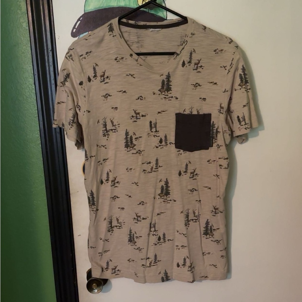 Large (I think) T-shirt of an unknown brand, it’s got lil deer on it